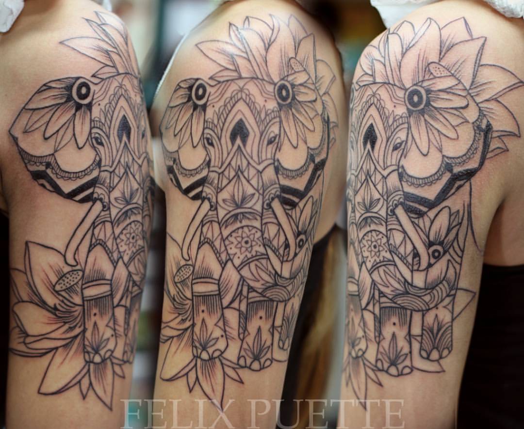 Attractive Elephant With Flowers Tattoo On Half Sleeve