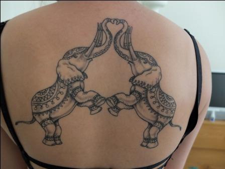 Awesome Black Two Circus Elephant Tattoo On Upper Back