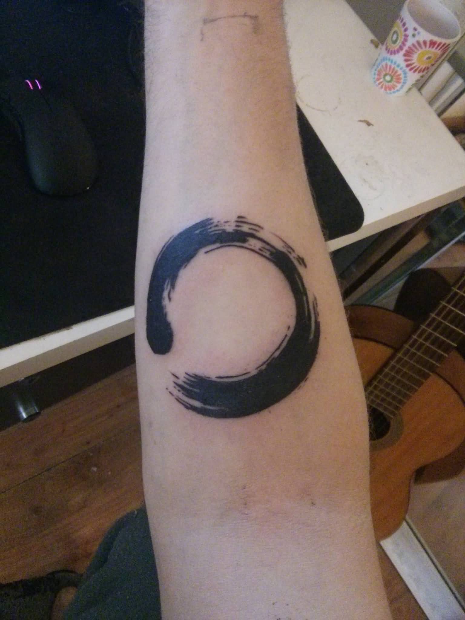 Awesome Black Zen Circle Tattoo On Forearm