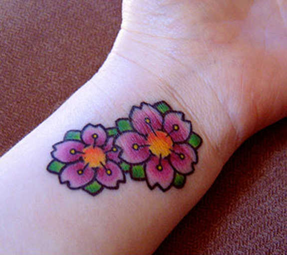 Awesome Color Flowers Tattoo On Left Wrist