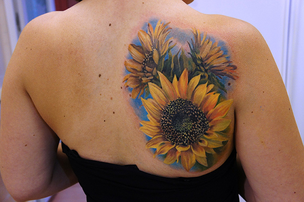 Awesome Colored Realistic Sunflower Tattoo On Back Shoulder