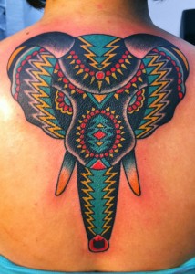 Awesome Colorful Traditional Elephant Tattoo On Upper Back