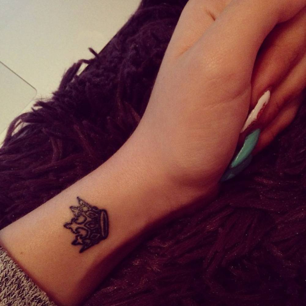 Awesome Crown Tattoo On Girl Left Wrist