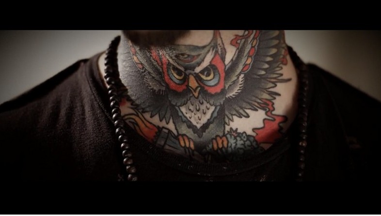 Awesome Flying Owl Tattoo On Throat