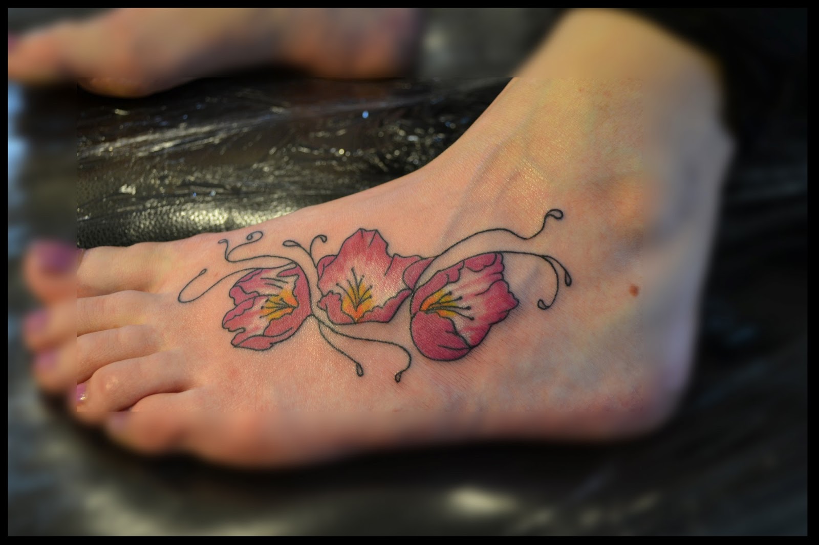 Awesome Rhododendron Flowers Tattoo On Girl Left Foot