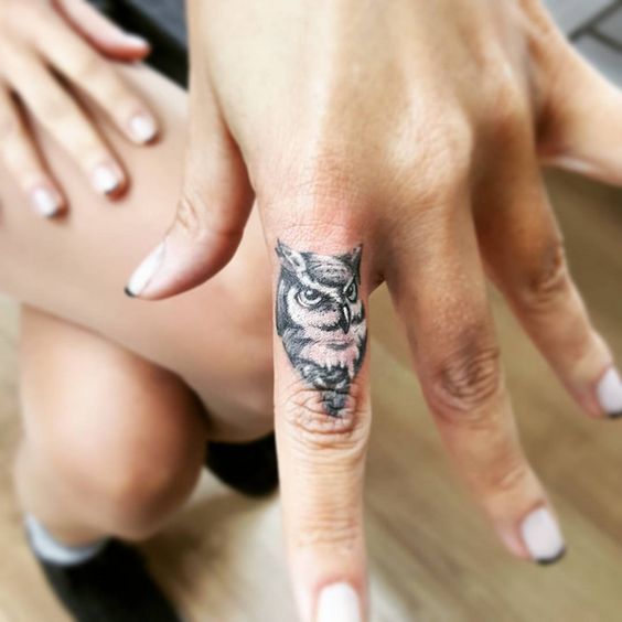 Baby Owl Head Tattoo On Finger