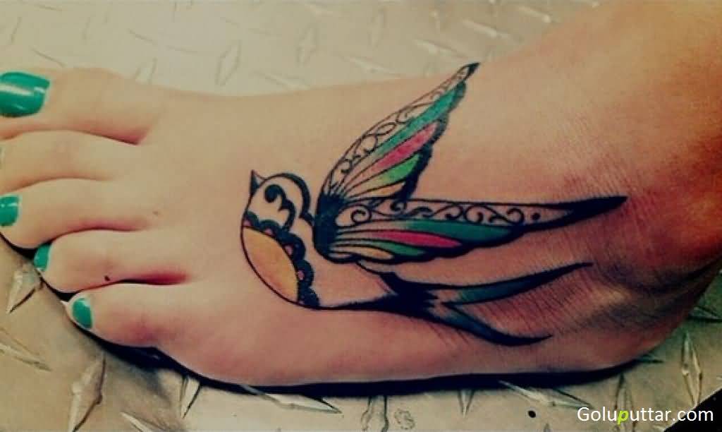 Beautiful Colored Flying Bird Ankle Tattoo