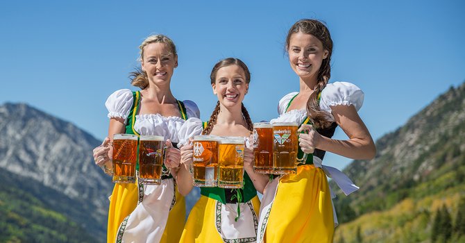 Beautiful Girls With Beer Mugs During Oktoberfest Celebration