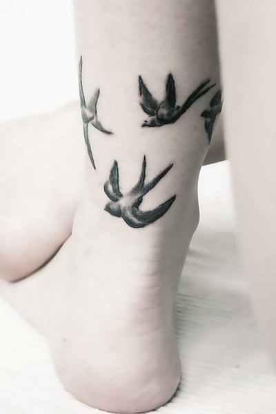 Black And Grey Birds Ankle Tattoo