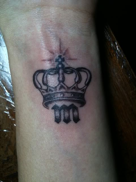 Black And Grey Crown Tattoo On Left Wrist For Girls