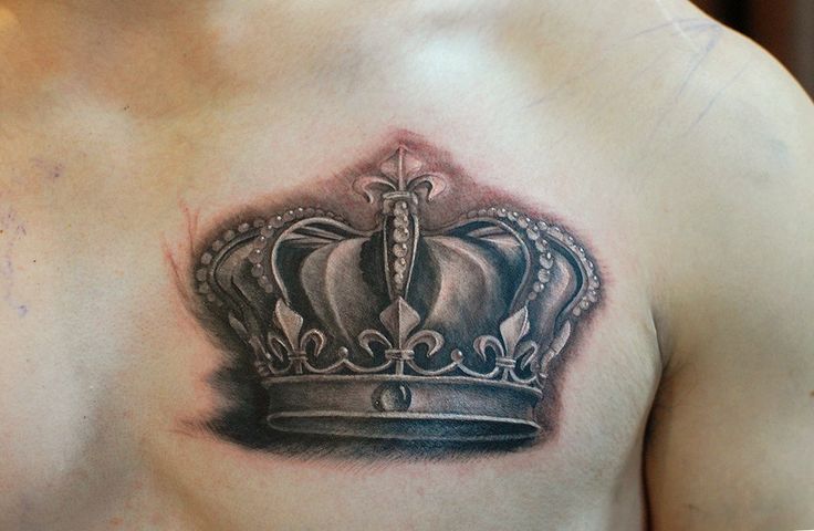 Black And Grey Crown Tattoo On Man Chest