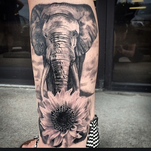 Black And Grey Elephant And Sun Flower Realistic Tattoo On Side Leg