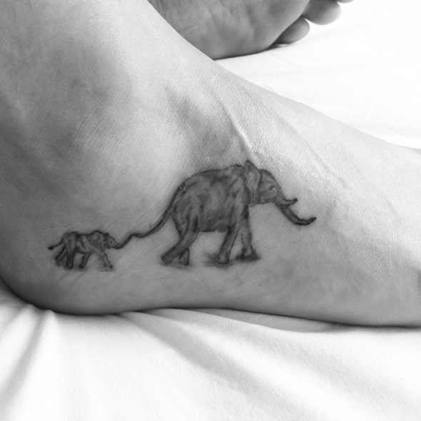 Black And Grey Elephant With Baby Elephant Tattoo On Ankle