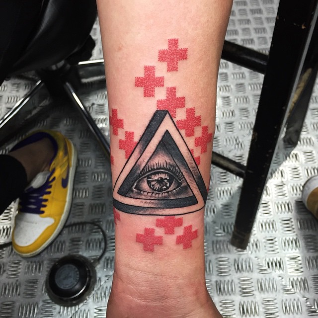 Black And Grey Eye In Triangle Tattoo On Forearm