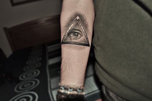 Black And Grey Eye In Triangle Tattoo On Right Forearm