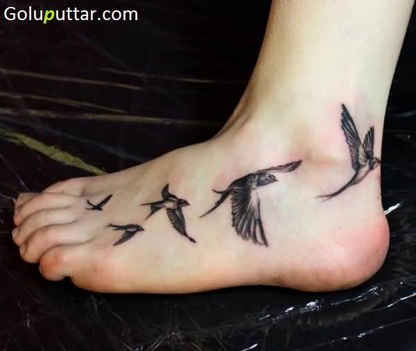 Black And Grey Flying Birds Ankle Tattoo