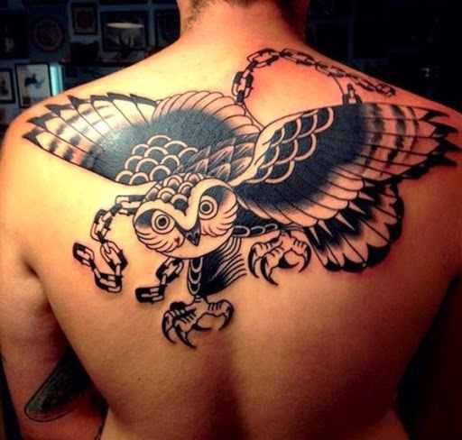 Black And Grey Flying Owl Tattoo On Man Upper Back