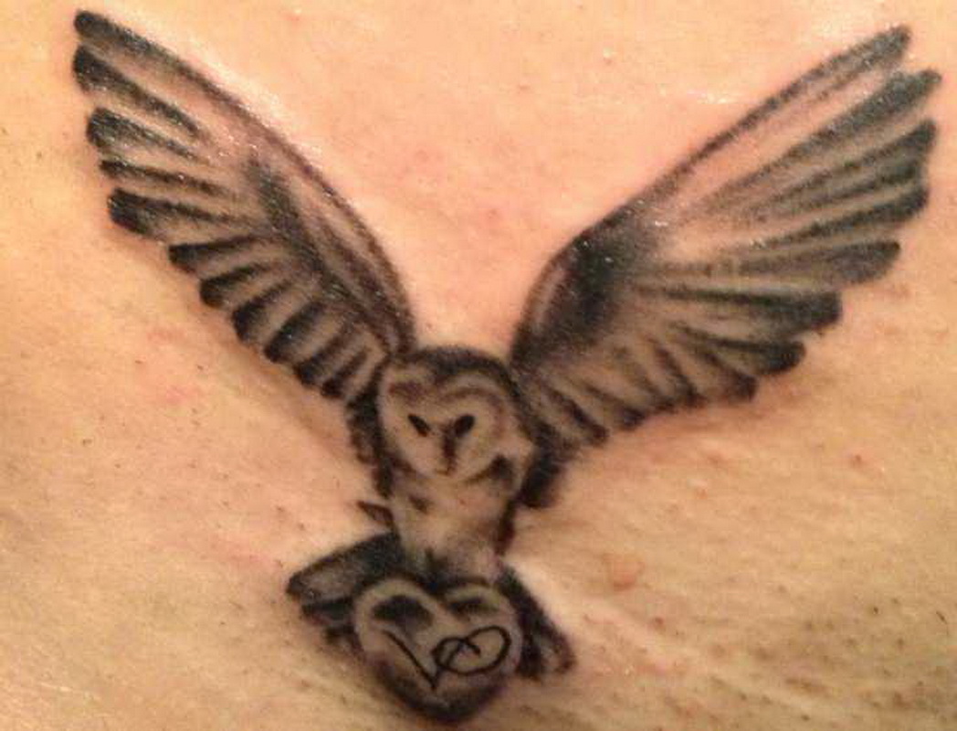 Black And Grey Ink Flying Owl Tattoo