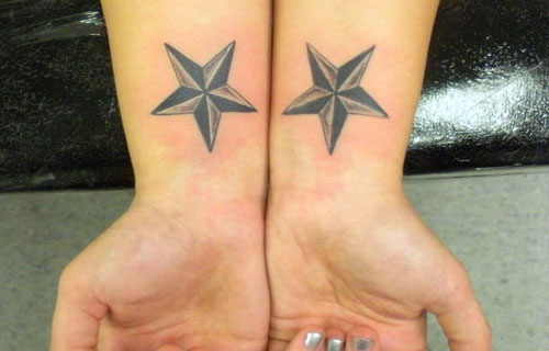Black And Grey Nautical Stars Tattoos On Wrists