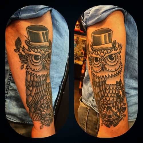 Black And Grey Owl With Triangle Eye Tattoo On Right Arm
