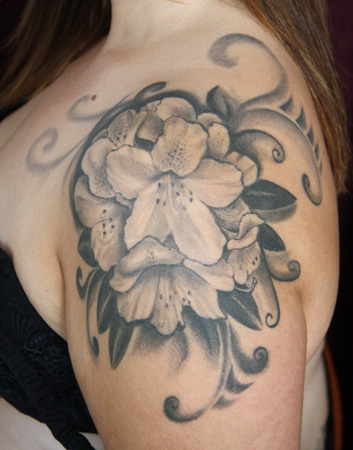 Black And Grey Rhododendron Flower Tattoo On Girl Left Shoulder