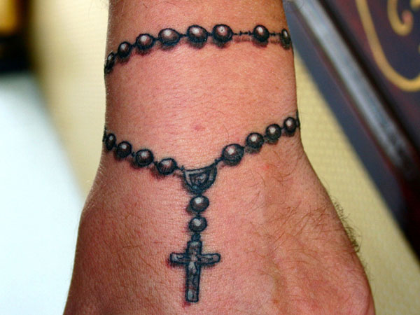Black And Grey Rosary Cross Tattoo On Wrist For Men