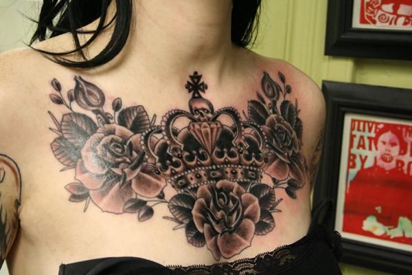 Black And Grey Roses And Crown Tattoo On Man Chest