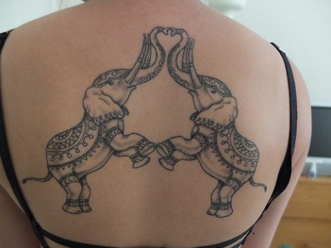 Black And Grey Two Indian Elephants Tattoo On Girl Upper Back