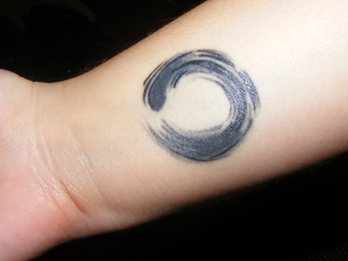 Black And Grey Zen Circle Tattoo On Forearm