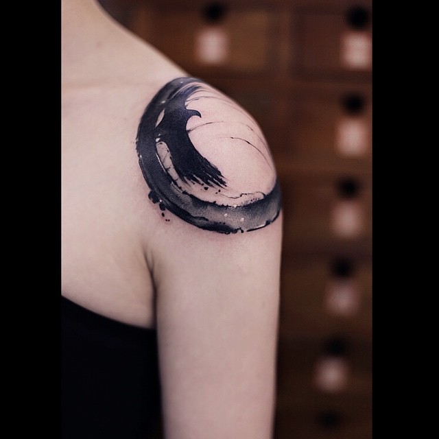 Black And Grey Zen Circle Tattoo On Left Shoulder