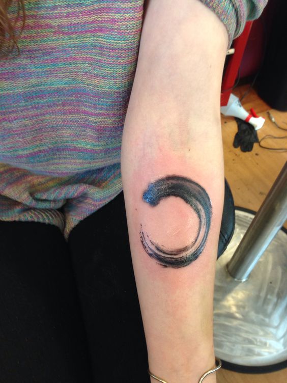Black And Grey Zen Enso Circle Tattoo On Girl Forearm