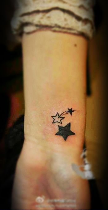 Black And Outline Star Tattoos On Wrist