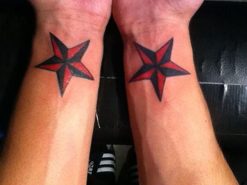 Black And Red Nautical Stars Tattoos On Wrist For Men