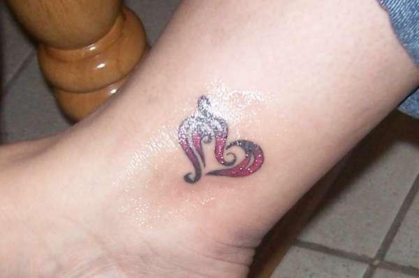 Black And Red Tribal Heart Ankle Tattoo