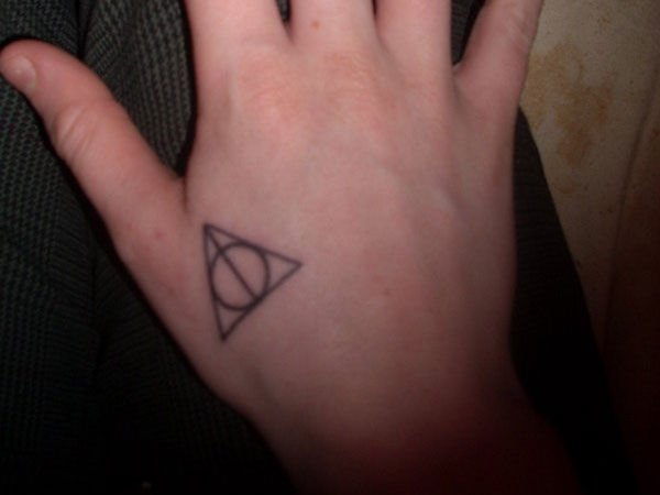 Black Circle In Triangle Tattoo On Right Hand
