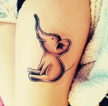 Black Ink Baby Elephant Tattoo On Left Thigh