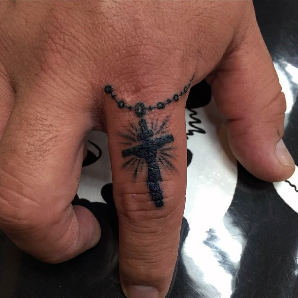 Black Ink Cross Tattoo On Finger