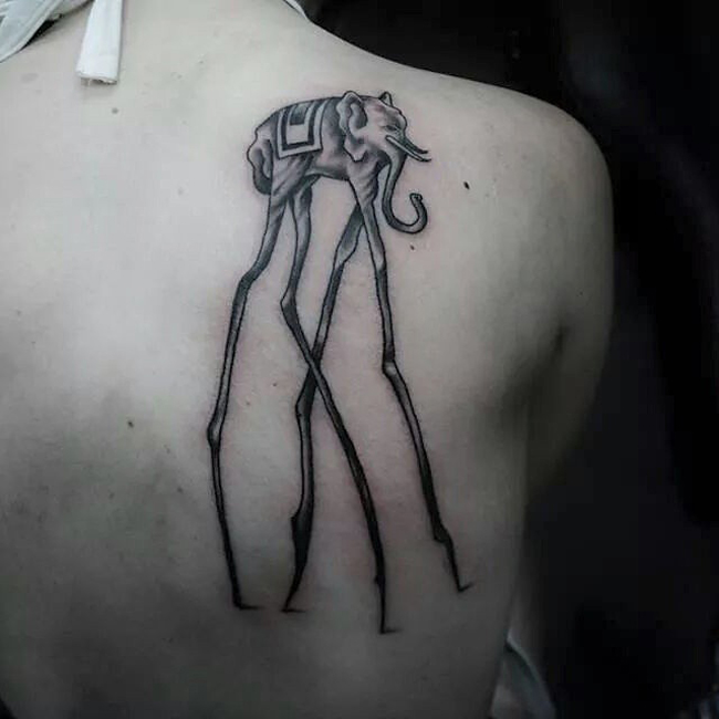 Black Ink Dali Elephant Tattoo On Right Back Shoulder