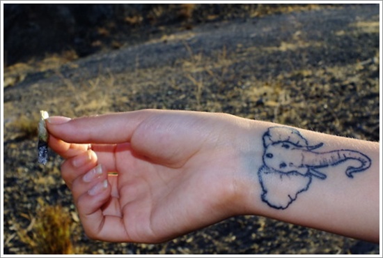 Black Ink Elephant Head Tattoo On Girl Left Wrist