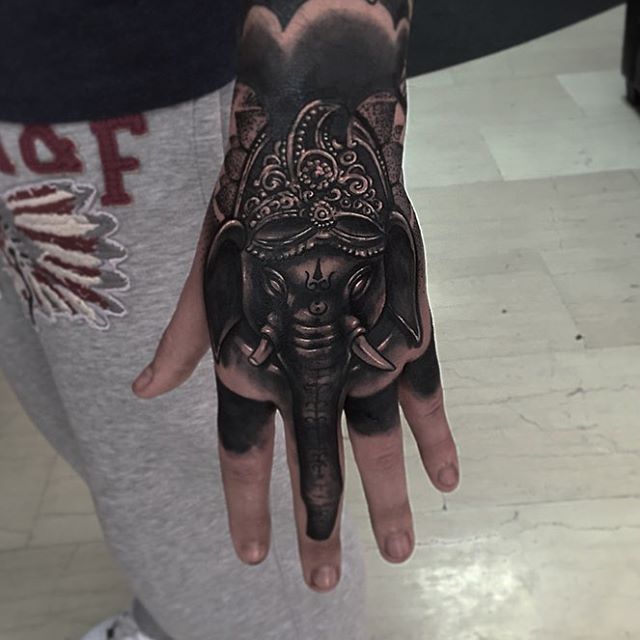 Black Ink Elephant Head Tattoo On Left Hand