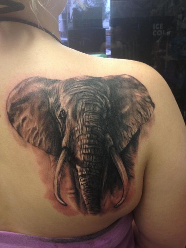 Black Ink Elephant Tattoo On Girl Right Back Shoulder