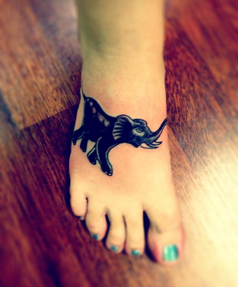Black Ink Elephant Tattoo On Girl Right Foot