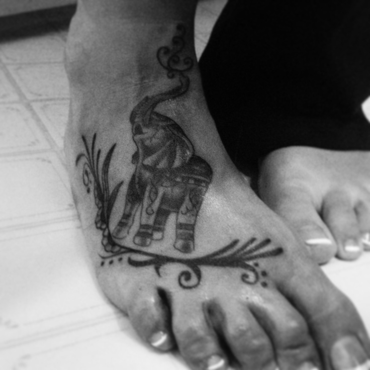 Black Ink Elephant Trunk Up Tattoo On Right Foot