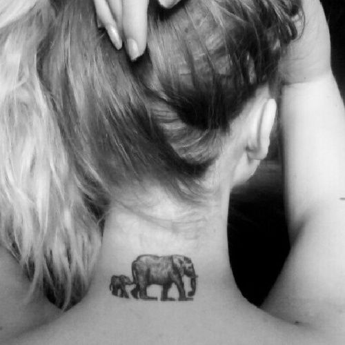 Black Ink Elephant With Baby Elephant Tattoo On Girl Back Neck