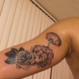 Black Ink Rhododendron Flowers Tattoo On Bicep