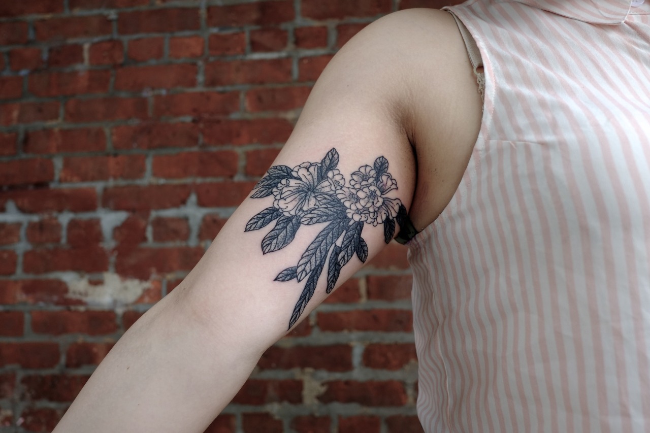 Black Ink Rhododendron Flowers Tattoo On Right Bicep