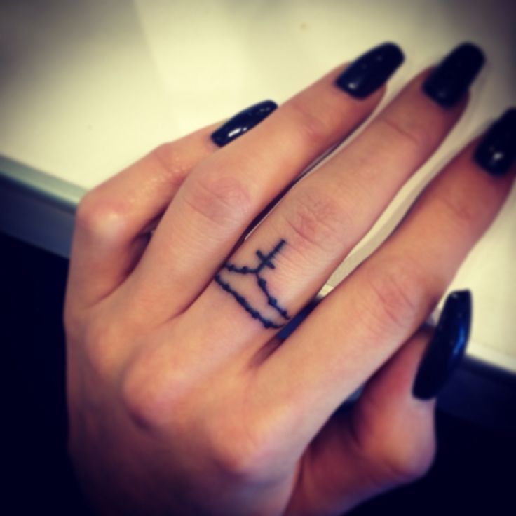 Black Ink Rosary Cross Tattoo on Finger