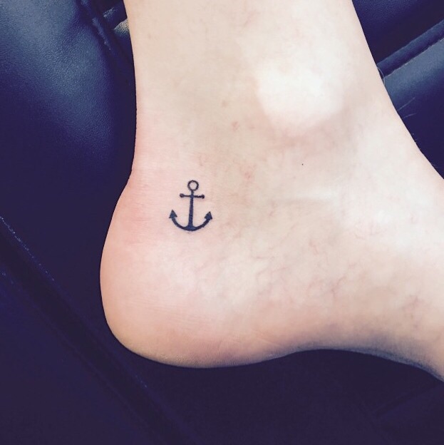 Black Ink Small Anchor Tattoo On Ankle