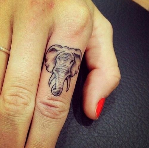Black Ink Small Elephant Head Tattoo On Girl Finger