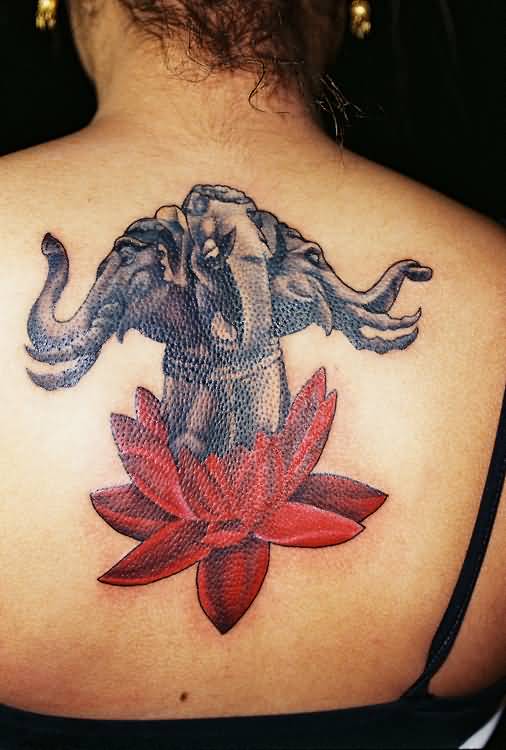 Black Ink Three Heads On Lotus Flower Tattoo On Girl Upper Back